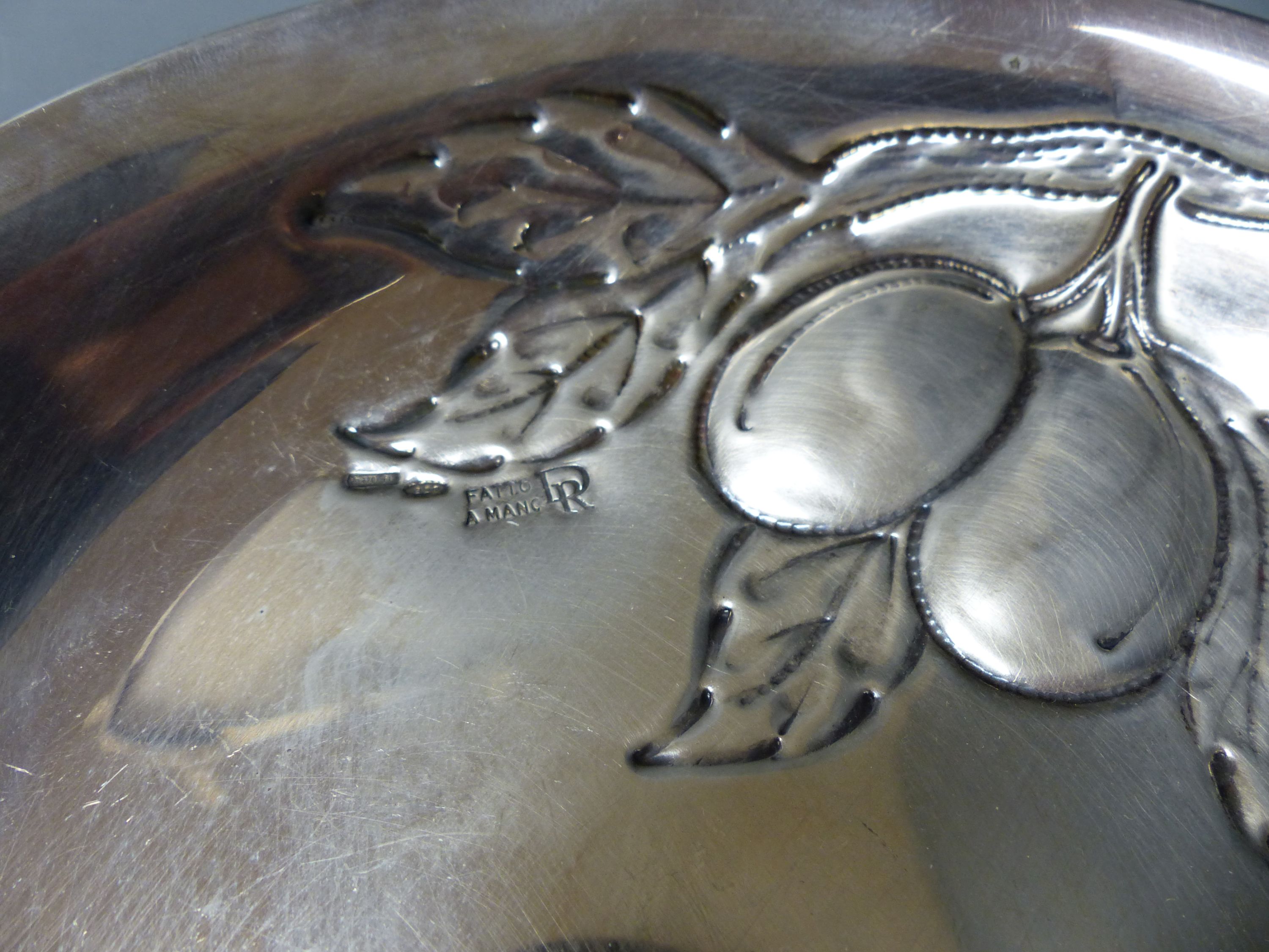 A George V silver waiter, Chester, 1921, 17.9cm and an Italian 800 standard white metal bowl embossed with fruit